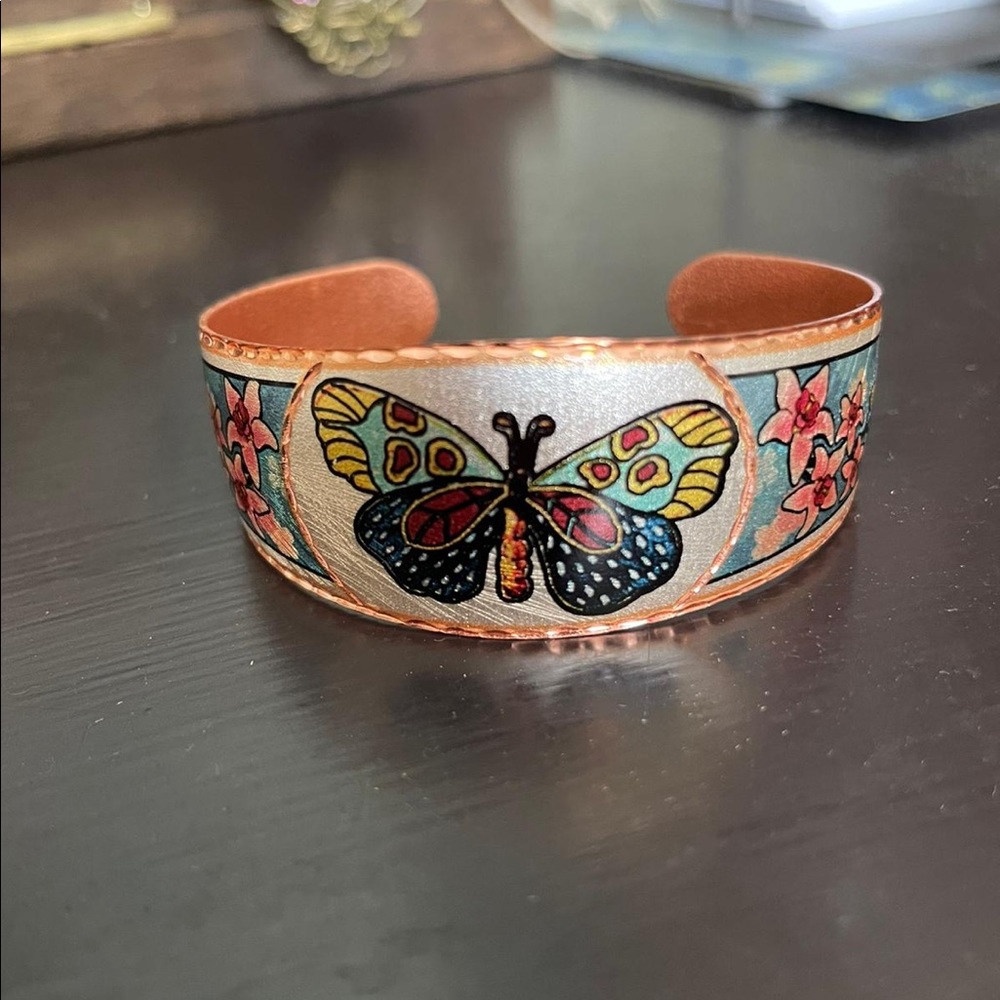 Handcrafted bracelet with butterfly design.